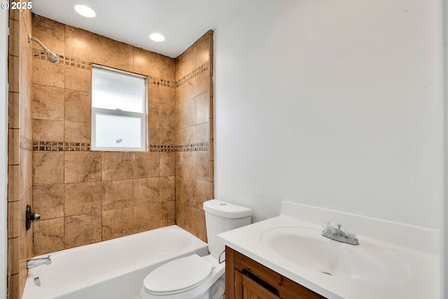bathroom with vanity, shower / bathing tub combination, and toilet