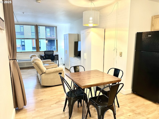 dining room with light hardwood / wood-style floors