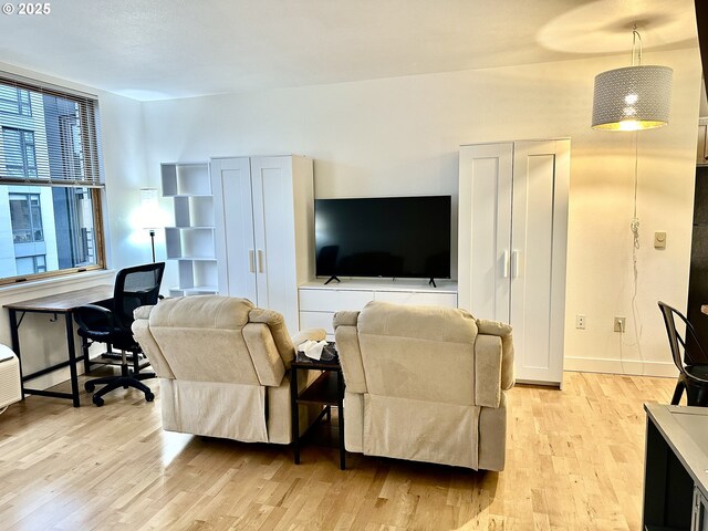 dining area featuring light wood-type flooring