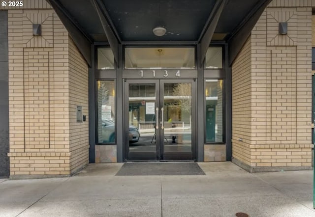 view of exterior entry featuring french doors