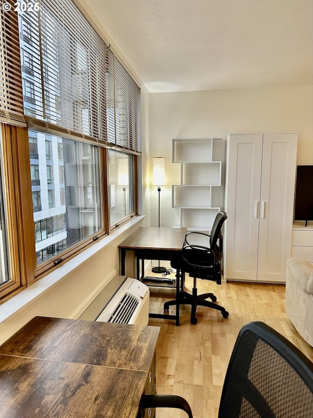 office space with light wood finished floors