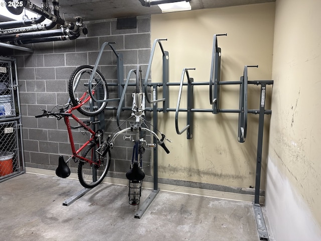 garage featuring bike storage and concrete block wall