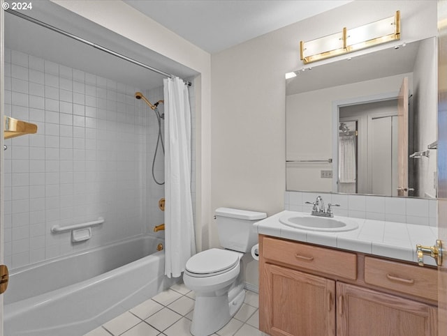 full bathroom featuring tile patterned flooring, vanity, shower / bath combination with curtain, and toilet