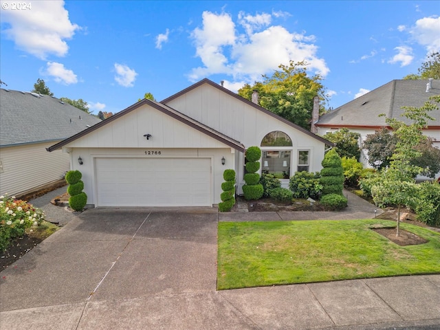 view of front of home with a garage and a front yard