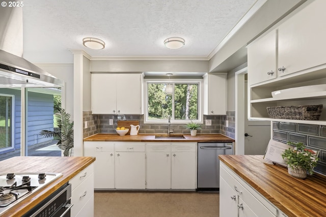 kitchen with a sink, decorative backsplash, butcher block countertops, and dishwasher