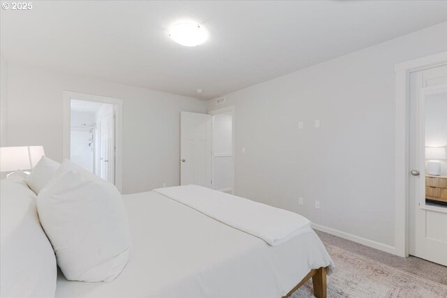 7010 SW Barr Ln, Tualatin, OR 97062 - bedroom featuring light carpet and connected bathroom