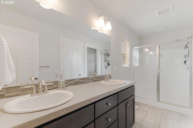 7010 SW Barr Ln, Tualatin, OR 97062 - bathroom featuring a stall shower, double vanity, and tile patterned floors
