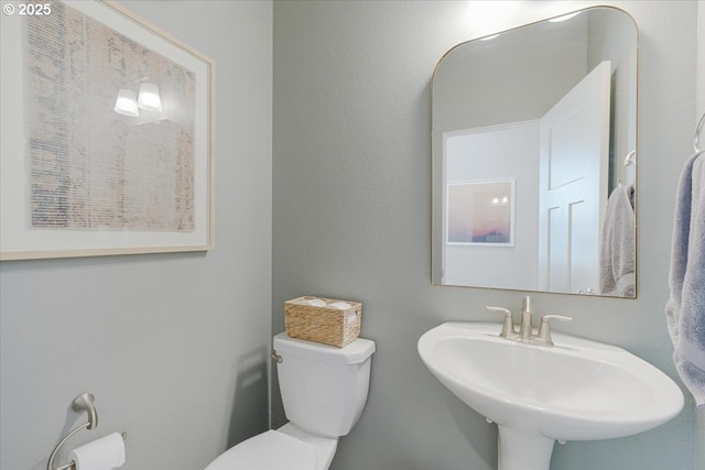 7010 SW Barr Ln, Tualatin, OR 97062 - half bathroom with toilet and a sink