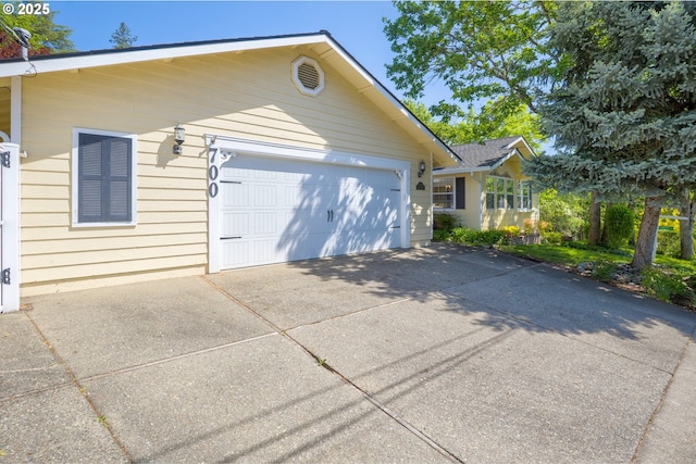 exterior space with an attached garage and driveway