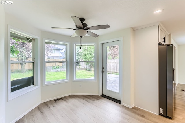 interior space with visible vents, baseboards, ceiling fan, light wood-type flooring, and recessed lighting
