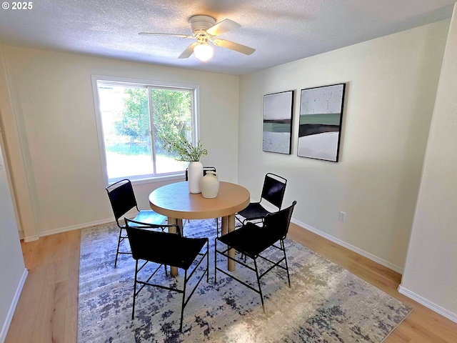 16400 NE 12th St, Vancouver, WA 98684 - dining room with light wood-type flooring, a textured ceiling, ceiling fan, and baseboards