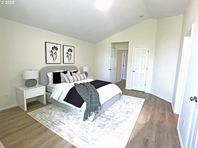 16400 NE 12th St, Vancouver, WA 98684 - bedroom featuring wood finished floors, lofted ceiling, and baseboards