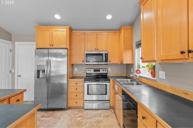 kitchen with appliances with stainless steel finishes and sink