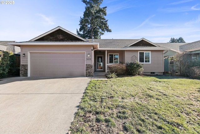 ranch-style home featuring a garage and a front lawn