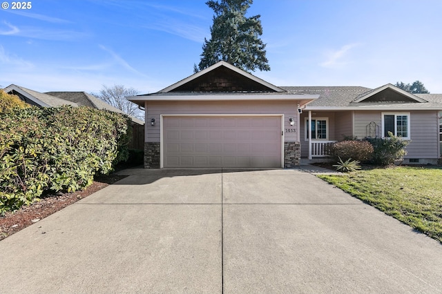 view of front of property featuring a garage and a front lawn