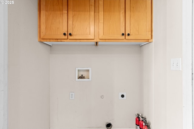 clothes washing area with washer hookup, cabinets, hookup for an electric dryer, and gas dryer hookup