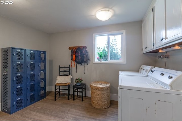 3681 Silverstone Ct NE, Salem, OR 97305 - washroom with cabinet space, light wood finished floors, and independent washer and dryer