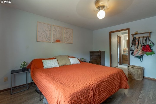3681 Silverstone Ct NE, Salem, OR 97305 - bedroom featuring baseboards, ensuite bath, and wood finished floors