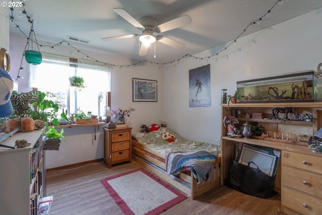 3681 Silverstone Ct NE, Salem, OR 97305 - bedroom featuring ceiling fan, light wood-type flooring, and visible vents