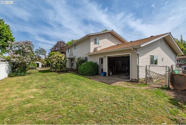 3681 Silverstone Ct NE, Salem, OR 97305 - back of property with fence, a gate, a lawn, and a garage