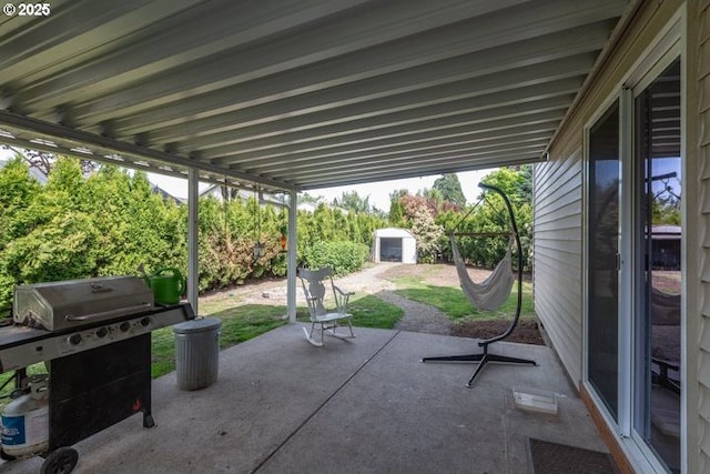 3681 Silverstone Ct NE, Salem, OR 97305 - view of patio / terrace featuring area for grilling, an outbuilding, and a storage shed