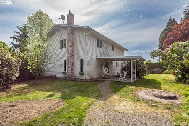3681 Silverstone Ct NE, Salem, OR 97305 - back of property featuring fence, crawl space, a chimney, a patio, and a yard