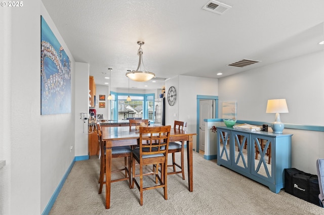 260 N Pacific St, Rockaway Beach, OR 97136 - dining room with light carpet, recessed lighting, and baseboards