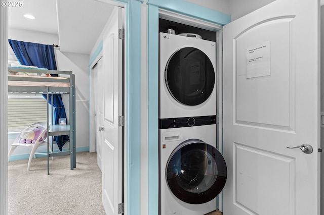 260 N Pacific St, Rockaway Beach, OR 97136 - laundry area with stacked washer / drying machine, carpet, and recessed lighting