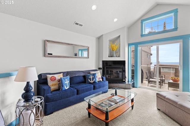 260 N Pacific St, Rockaway Beach, OR 97136 - carpeted living area with high vaulted ceiling, recessed lighting, and a tile fireplace