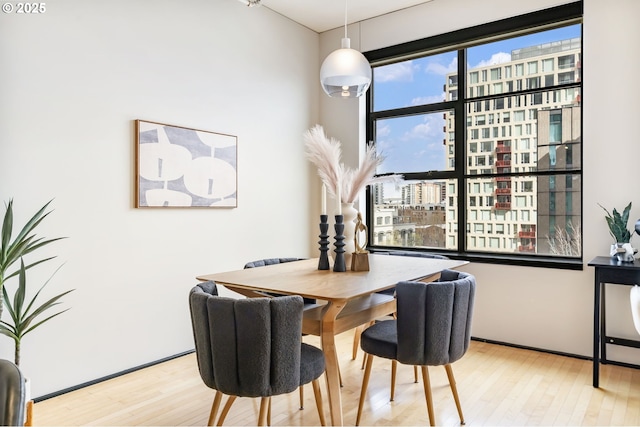 333 NW 9th Ave Unit 713, Portland, OR 97209 - dining area featuring wood finished floors