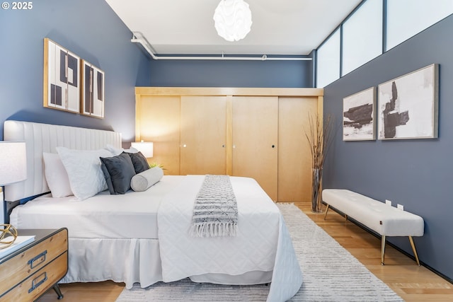 333 NW 9th Ave Unit 713, Portland, OR 97209 - bedroom featuring wood finished floors and a closet