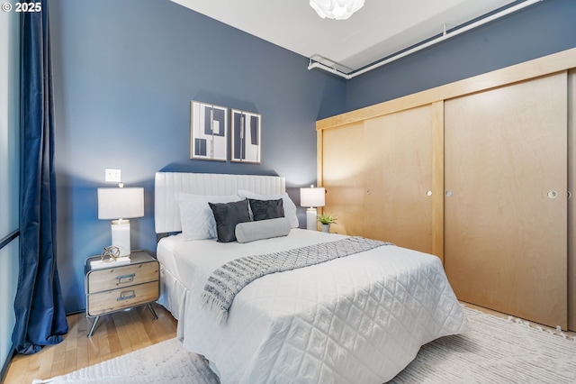 333 NW 9th Ave Unit 713, Portland, OR 97209 - bedroom with wood finished floors and a closet