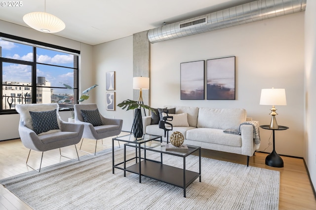 333 NW 9th Ave Unit 713, Portland, OR 97209 - living room featuring wood finished floors