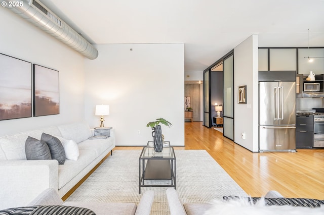 333 NW 9th Ave Unit 713, Portland, OR 97209 - living area with light wood finished floors