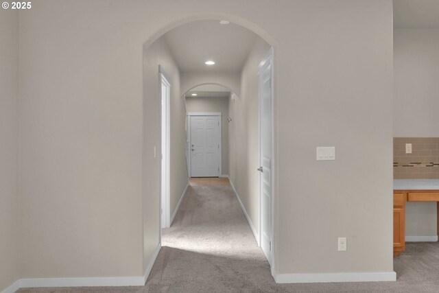3015 Guadalupe Way, Eugene, OR 97408 - hallway featuring arched walkways, light colored carpet, baseboards, and recessed lighting