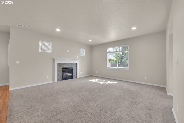 3015 Guadalupe Way, Eugene, OR 97408 - unfurnished living room with a fireplace, recessed lighting, baseboards, and carpet floors