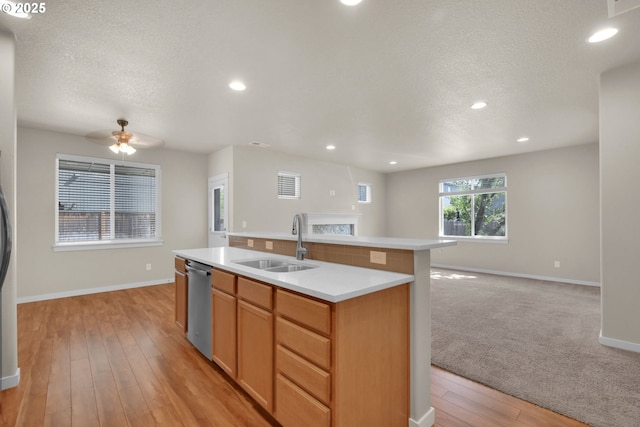 3015 Guadalupe Way, Eugene, OR 97408 - kitchen featuring a sink, dishwasher, open floor plan, light countertops, and baseboards