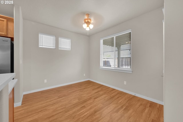 3015 Guadalupe Way, Eugene, OR 97408 - unfurnished dining area featuring light wood-type flooring, ceiling fan, and baseboards
