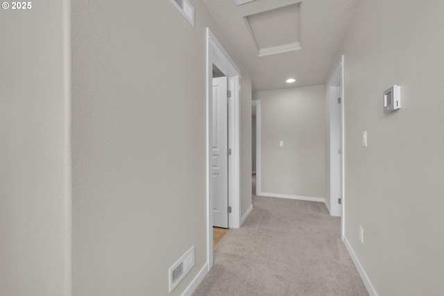 3015 Guadalupe Way, Eugene, OR 97408 - corridor featuring light carpet, attic access, baseboards, and recessed lighting