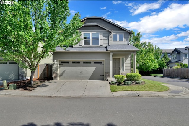 3015 Guadalupe Way, Eugene, OR 97408 - view of front facade featuring driveway, a garage, and stone siding