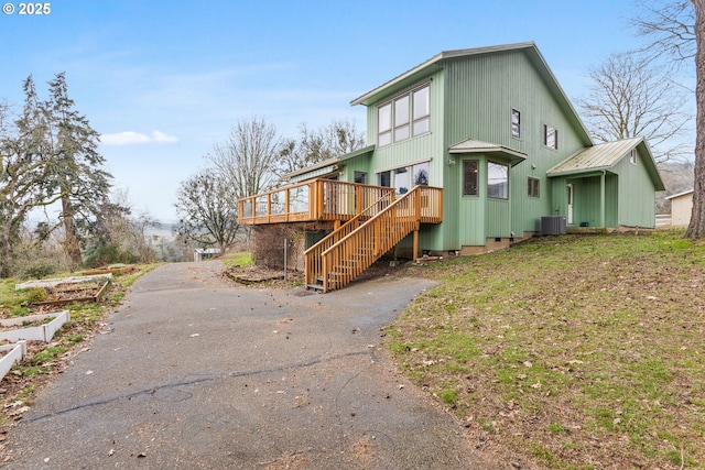 exterior space with central AC and a deck