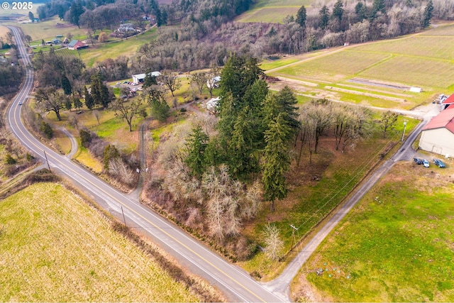 birds eye view of property with a rural view