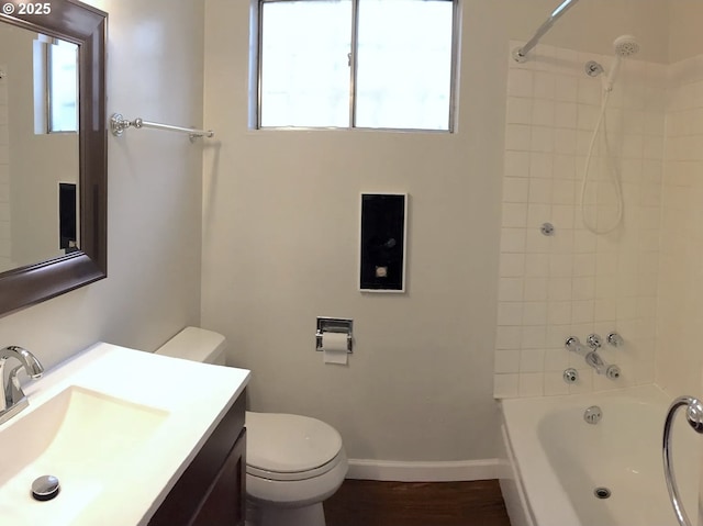 2544 NE Hoyt St, Portland, OR 97232 - bathroom with vanity, shower / tub combination, toilet, wood finished floors, and baseboards