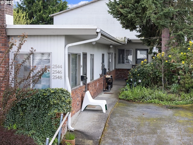 2544 NE Hoyt St, Portland, OR 97232 - exterior space featuring a patio and brick siding