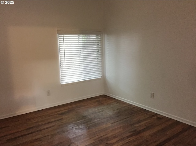 2544 NE Hoyt St, Portland, OR 97232 - spare room with baseboards and dark wood-style floors