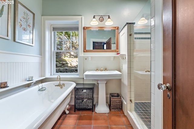 2783 NE Wiberg Ln, Portland, OR 97213 - full bathroom featuring a soaking tub, tile patterned floors, tiled shower, and wainscoting