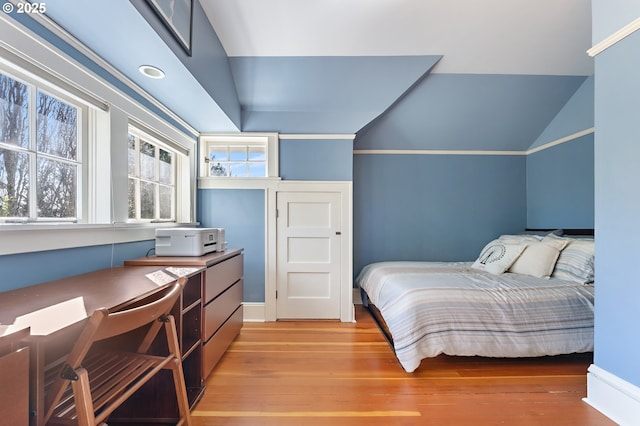 2783 NE Wiberg Ln, Portland, OR 97213 - bedroom with light wood-style flooring, lofted ceiling, and a desk