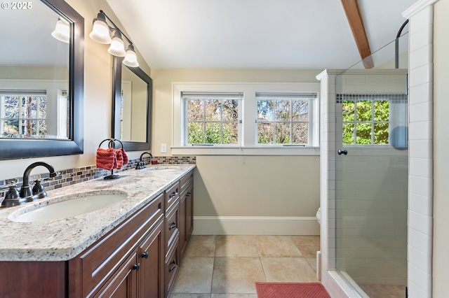 2783 NE Wiberg Ln, Portland, OR 97213 - full bathroom featuring plenty of natural light, double vanity, tiled shower, baseboards, and beamed ceiling
