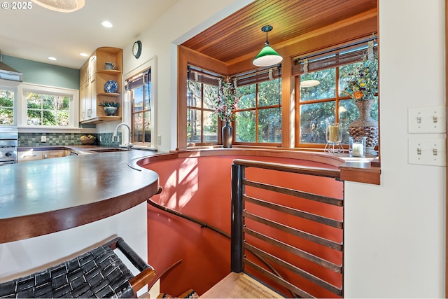 2783 NE Wiberg Ln, Portland, OR 97213 - bar with a sink, hanging light fixtures, recessed lighting, and backsplash