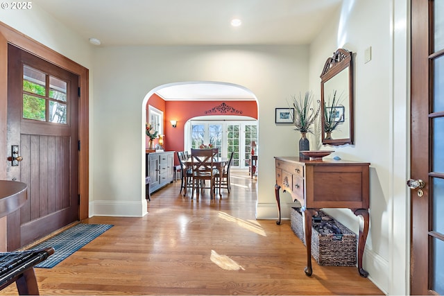 2783 NE Wiberg Ln, Portland, OR 97213 - foyer entrance featuring arched walkways, wood finished floors, baseboards, and recessed lighting